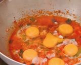 A picture of step 3 of Baked egg with red sauce.