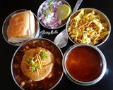 A picture of step 10 of Misal Pav with spicy Tari.