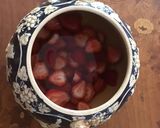 A picture of step 1 of California Farm Rum Topf Fresh Fruit Punch.