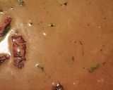 A picture of step 4 of Ulli theeyyal (shallots cooked in roasted coconut gravy and tamarind juice).