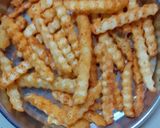 A picture of step 6 of Peri peri fries.