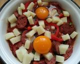 A picture of step 7 of Saganaki with Country Sausage, Eggs, and Graviera Cheese.