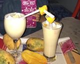 A picture of step 1 of #fiveingredients. Mango shake with cream.