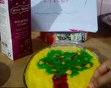 A picture of step 11 of Mango custard cake with green mango tree.