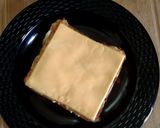A picture of step 7 of Cheesy Egg Toast Grilled Sandwich.