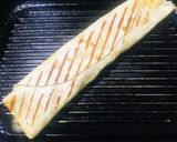 A picture of step 3 of Mango 🥭 sausages wrap.