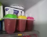 A picture of step 3 of Watermelon Ice Popsicles.