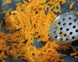 A picture of step 1 of Carrot Halwa in a Frozen Cashew Apple Phirni Mousse Cake.