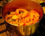 A picture of step 3 of Drum stick tomato masala curry (sambar) mixed with rice.