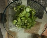 A picture of step 1 of Orange, Kiwi, and Unsweetened Almond Milk Smoothie.
