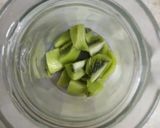 A picture of step 1 of Kiwi mint mojito 🥝🥝.