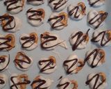 A picture of step 4 of Pumpkin Spice Chocolate Coated Pretzels.