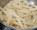 A picture of step 1 of Penne in red sauce with herbs.
