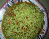 A picture of step 5 of Indomitable jollof.