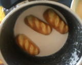 Foto del paso 3 de la receta: Torrijas de chocolate y naranja, con panecillos de leche