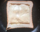 A picture of step 6 of Cheesy Egg Toast.