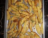 A picture of step 3 of Baked rosemary potatoe wedges.