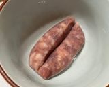 A picture of step 1 of Cabbage and Onion Sausage Fried Rice.