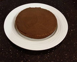 A picture of step 14 of Mocha Layer Cake with Whipped Mascarpone Cream and a Coffee Glaze Drizzle.