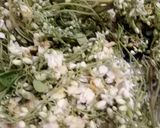 A picture of step 1 of Sahjan ke phul ka saag (drumstick flower curry).