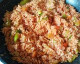 A picture of step 4 of Red Rice with Corn.