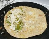 A picture of step 5 of Mexican avocado cheese taco.