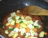 A picture of step 9 of Navratan Korma.