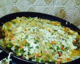 A picture of step 35 of Lasagna in a pan.