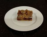 A picture of step 15 of Fresh Berrie Crumble Bars with White and Milk Chocolate Glaze.