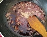 A picture of step 6 of Znoud-el-sit with creamy choco hummus filling and red grape sauce.