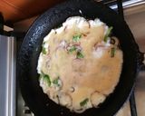 A picture of step 2 of Chapati egg roll.