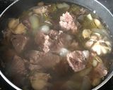 A picture of step 1 of Green bean stew فاصوليا خضراء.