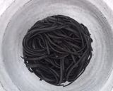 A picture of step 1 of Lemon and Lime Charcoal Noodles with Green Herbs and Veggies 🌱.