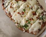 A picture of step 5 of Chessey garlic naan sticks.