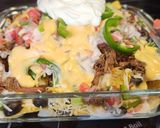 A picture of step 3 of 4 Cheese loaded nachos.