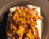 A picture of step 4 of STEAK and SHREDDED CHICKEN BURRITOS WITH MELTED CHEESE/FRITOS: JAYS SMOTHERED BURRITO.