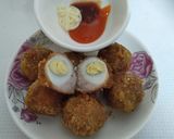 Hình bước làm 4 của món Thịt Bọc Trứng Cút Lăn Cốm Chiên