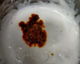 A picture of step 3 of Onion rice with tadka raita.