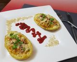 A picture of step 8 of Maggi stuffed jacket potatoes.