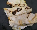 A picture of step 11 of Paneer packets in tomato gravy.