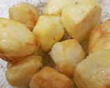 A picture of step 5 of Parmesan smashed Roast Potatoes.