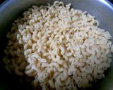 A picture of step 1 of Spicy Macaroni with Chicken franksn Shimla Mirch.