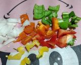 A picture of step 2 of Egg Burrito with Peppers and Chorizo Queso.