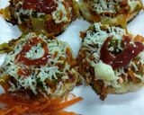 A picture of step 3 of Cheesy pizza shots.