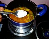 A picture of step 8 of Boiled rice served with minji stew and potatoes.