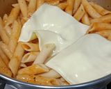 A picture of step 3 of Penne in red sauce with herbs.