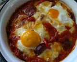 A picture of step 8 of Saganaki with Country Sausage, Eggs, and Graviera Cheese.