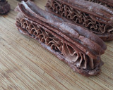 Foto del paso 15 de la receta: Eclairs de cacao relleno de trufa de chocolate