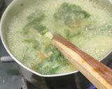A picture of step 1 of Winter homemade palak saag, peas, corn soup.