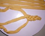 A picture of step 7 of Lemon flavored braided mandazi.